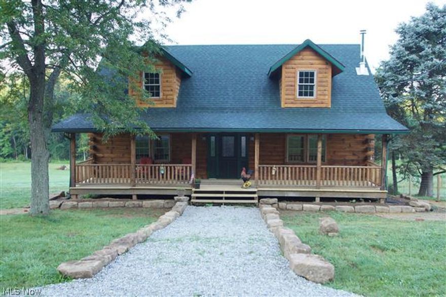 Beautiful, renovated log cabin on 15 fenced-in acres.  4 bdrms, 3 baths.  Potentially 2 addl bdrms LL.  Awesome post & beam w/ open floor plan.  Lots of wood & ceramic flrng.  Great room w/ cathedral ceiling & stone, floor-to-ceiling wood burning fireplace.  Lg kitchen w/ hickory cabinets, granite counters & breakfast bar.  Appliances stay.  Lg dining area.  Cathedral ceiling in sunroom.  Access huge deck off sunroom.  Sunroom & 2nd story deck offer spectacular, wooded views.  1st flr master bedroom & bath w/ 2 rooms.  1st flr laundry.  Upstairs: 3 bdrms, loft overlooking great room & full bath w/ ceramic flrg & granite counter.  Walk out LL: spacious family room, potentially 2 bdrms or ofc or media room & full bath.  Access covered deck from family room.  Stone barn.  2014: septic and public water.  Oversized 2-car garage.  Huge, inviting, serene front porch w/ wooded view.  Great home for entertaining, relazing or enjoying nature.  Secluded yet close to amenities.  Addl acreage avail