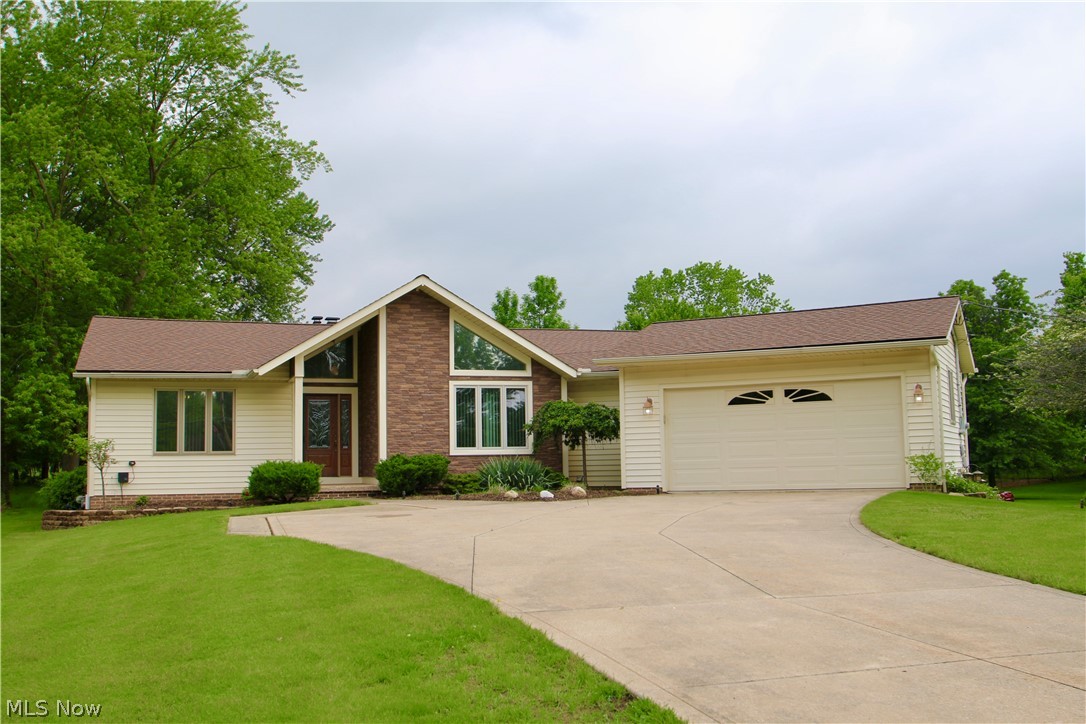This Split Ranch home is waiting for your personal touches. The Great Room has a Cathedral Ceiling and features a lovely gas fireplace. Fully finished basement includes a half bath and a tub and sink utility area for crafts or pet wash. Along with a full basement with storage shelving, there is a separate room for mechanicals and storage. There is also a lighted crawl access for additional storage. The rear of the home has a large fenced area for pets or privacy. A nice shed for yard and lawn equipment. A Large windowed 3 Season Room to enjoy additional living space. Enjoy the large eat in kitchen with ceramic tile and newer granite countertops along with a separate Formal Dining Room. A convenient First Floor Laundry off side hallway to garage entrance, washer and dryer included. The home is loaded with little extras like Retractable Screen Doors, Security System, updated vinyl brick laminate (applied 3 years ago), Nature Stone in the garage and Sun Room, Glass Block Win