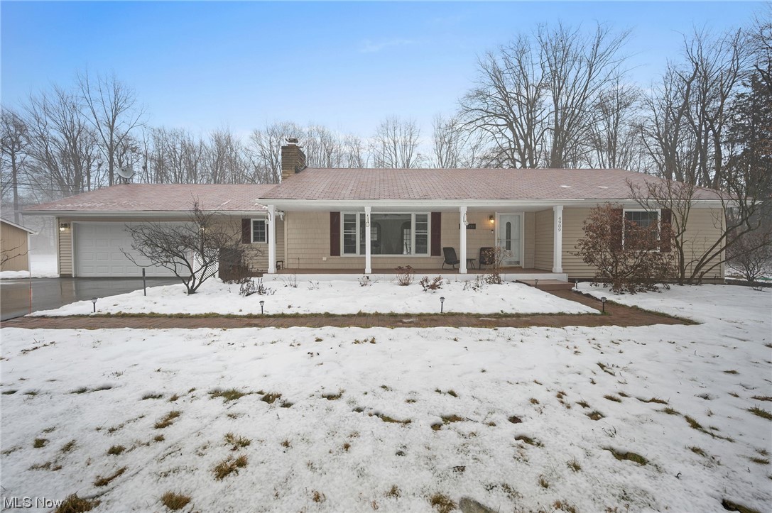 Like a retreat, this 3-bedroom ranch on 1.59 acres offers mid-century charm with one-floor living, updated interior, city water and new septic, all minutes from major highways, Orange Village amenities, restaurants and shopping in Chagrin Falls Village and Pinecrest. Large, bright living room with wood-burning fireplace is open to the expansive kitchen and dining area, with multiple ways to access the backyard deck and concrete patio. Off the kitchen is the laundry room, pantry, half bath (all with new LVT flooring in 2024) and access to the oversized 2-car garage. Three bedrooms share an updated hall bath with tub/shower. In the last two years the owners invested $125,000 in major projects: changed the HVAC system to forced air with new furnace, A/C, ductwork, removed baseboard units and refinished walls; new hot water tank (2022); converted well water to city water (2023); new septic (2022); new asphalt driveway (2022); removed knob and tube wiring (2022); installed attic and crawlspace insulation (2023); new sump pump (2023) and kitchen plumbing (2022). All rooms were freshly painted and hardwood floors refinished (2024). More improvements listed in supplements. Other features include invisible fence, interior crawlspace waterproofing and side-yard shed. Home warranty will transfer to buyer. POS compliant.