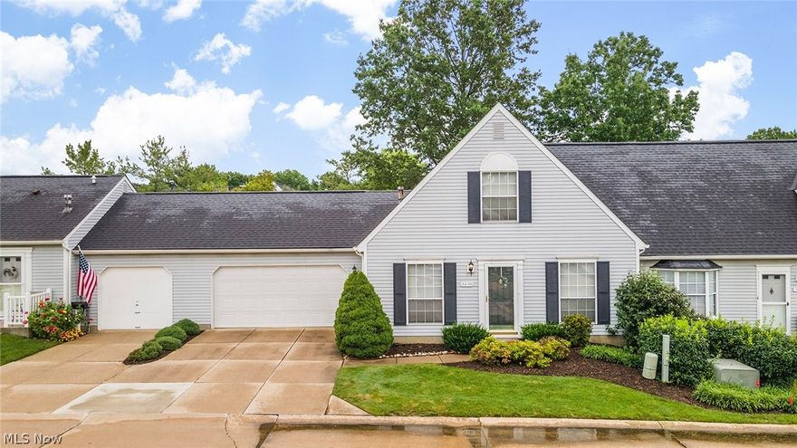 Welcome home to this beautifully updated condo in Cuyahoga Falls!  Enter this lovely home into the sunny living room and dining room with shining hardwood floors.  Pass through the fantastic kitchen with granite counters and stainless appliances that leads into a spacious open floor plan family and the dinette area, great for entertaining. The stunning fireplace sets this room apart! Off the dinette you'll find sliders out to the charming back patio.  Conveniently down the hall you will enjoy a remodeled half bath and laundry room, as well as access to the large 2 car garage! Retreat away upstairs to two very generously sized bedrooms with exceptional closet space.  Separating the rooms is an updated full bath with plenty of counter and storage space.  This welcoming condo is larger than many in the area and has the feel of a single family home. There's nothing to do but move in!  Dont miss it!