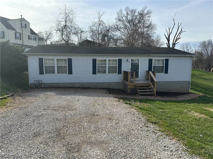 Welcome to this inviting 3 bedroom, 2 full bathroom home nestled conveniently close to South Parkersburg amenities, offering a picturesque view of downtown. This single-story residence boasts spacious walk-in closets in each of its three bedrooms, providing ample storage space and convenience. The kitchen features a stylish breakfast bar, perfect for casual dining or entertaining guests while preparing meals. Enjoy the airy and open feel of vaulted ceilings throughout the home, enhancing the sense of space and light. 
Ideal for those seeking a cozy home with easy access to urban amenities and a scenic view, this property promises both comfort and convenience.