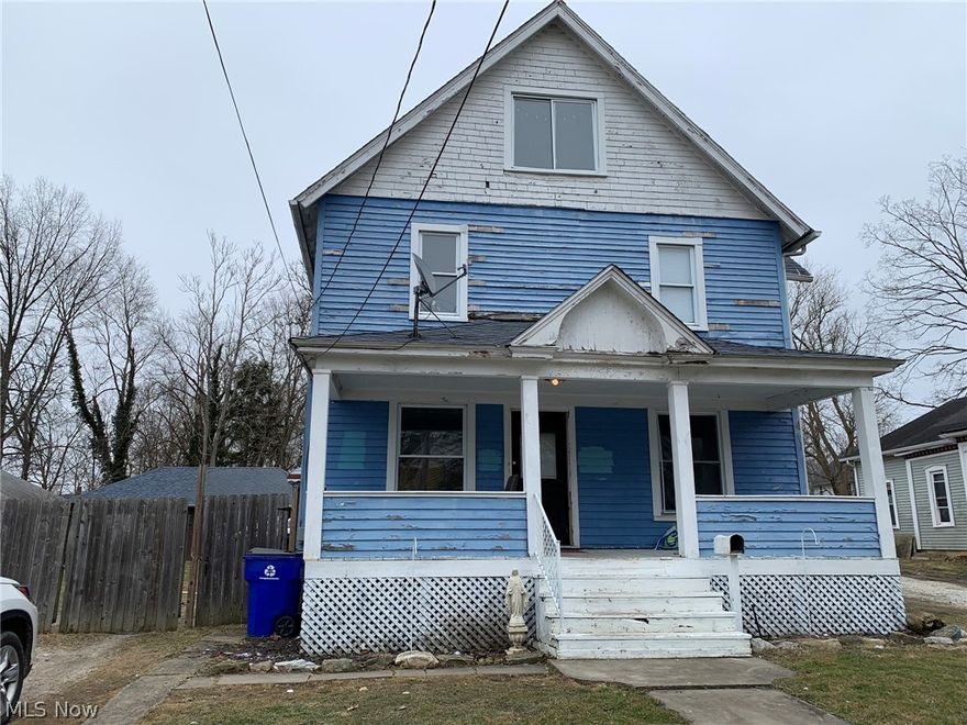 Restore this house to its former glory and beauty with your handy work! This house has a lot of really pretty character and charm, but needs TLC to bring some life back to it.  The upstairs 3rd floor has a HUGE halfways completed master suite with the second floor having four bedrooms and a full bath.  The first floor has a large kitchen, dining room and living area. There is a cute foyer that could really be beautiful with some love.  The basement has a full bathroom and has some partially finished areas.  This house really is a diamond in the rough and it just needs some serious polishing!  The fenced in yard houses a large garage out back, that according to the City of Ravenna zoning map, appears to be located in C-1 (Commercial) - buyer to do their own due diligence on this information provided.