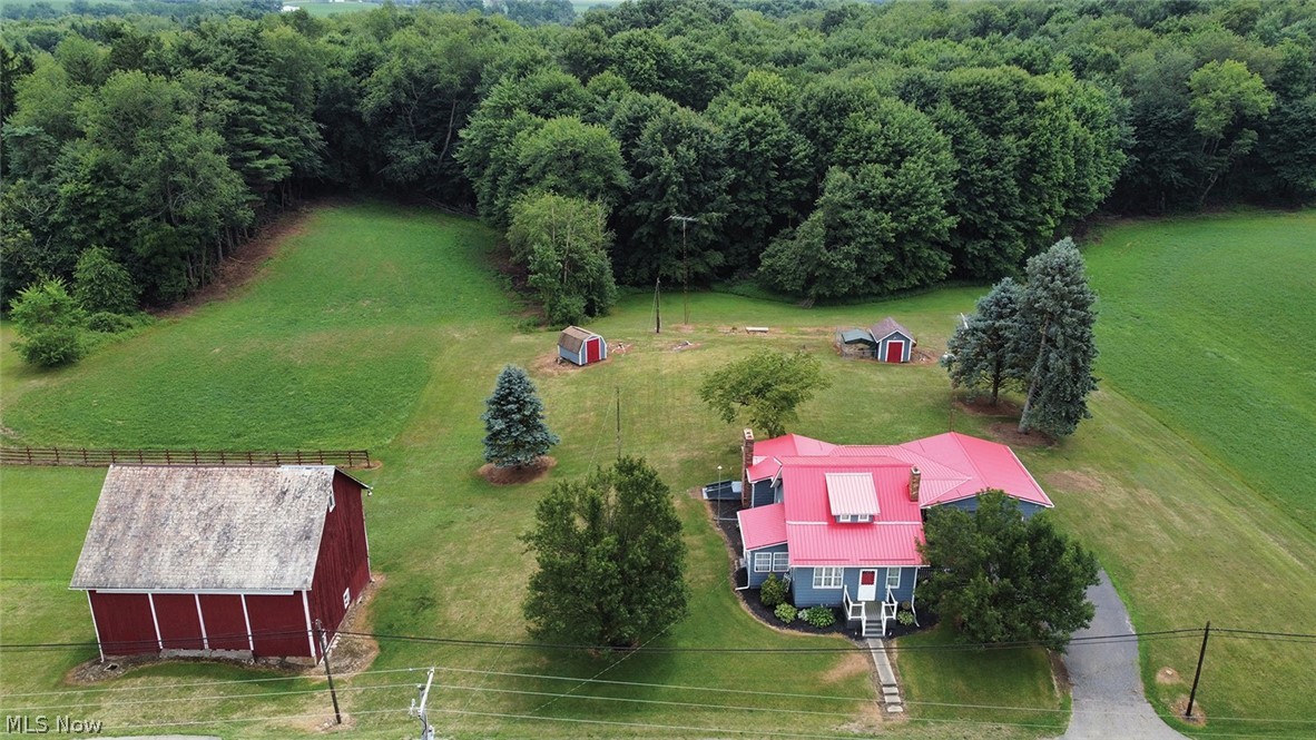 7.6-Acre Mini Farm with Good Home & Bank Barn - Storage Building - Knox Twp. - Columbiana Co. - West Branch Schools - Family-Owned 70+ Years. Online Bidding Available on Real Estate. ABSOLUTE AUCTION, all sells to the highest bidder on location.
ONLINE BIDDING BEGINS THURSDAY, AUGUST 8, 2024 – 12:00 PM, and AUCTION LIVE ON-SITE BIDDING WILL BEGIN MONDAY, AUGUST 12, 2024, 4:30 PM, REAL ESTATE SELLS AT 5:30 PM. Real Estate. Good two-story home. The main level features a large kitchen with loads of cabinet space, refrigerator, microwave, dining room with wood floors, living room with wood burning fireplace with built-in shelves, hardwood floors with access to the basement and rear patio, main-level full bath plus bedroom and half bath. Enclosed front porch. Two second-level bedrooms with walk-in cedar closet and knee-wall storage. Full divided basement, half finished with a fireplace with an outside entrance. Electric heat pump, central air, plus FA heat, updated breaker electric. Two-car attached garage, several updated windows, new metal roof in 2016, drilled water well with Kinetico softener, private septic system, plus 2nd septic with mobile home hookup. Good bank barn with water and electric, slate roof, 2 small storage barns. Open hay field and pastureland plus woods, flowing stream. Nice setting. You’ll like this property! TERMS ON REAL ESTATE: 10% down auction day, balance due at closing. A 10% buyer’s premium will be added to the highest bid to establish the purchase price. Any desired inspections must be made prior to bidding. All information contained herein was derived from sources believed to be correct. Information is believed to be accurate but not guaranteed.