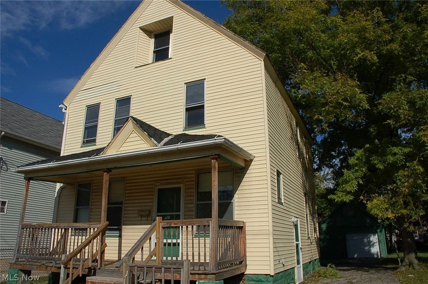 Spacious vinyl sided colonial features a roomy kitchen, formal dining, livingroom with decorative fireplace, and a bath on first and second floors. Great front porch plus an enclosed sun room for evening dining or morning coffee.  Oversized garage, mostly fenced yard comes with an additional lot to the right of the home. Put this on your list to add to your rental portfolio or to live in while making repairs and updates to your liking, with plenty of room for outdoor entertaining on the additional lot!