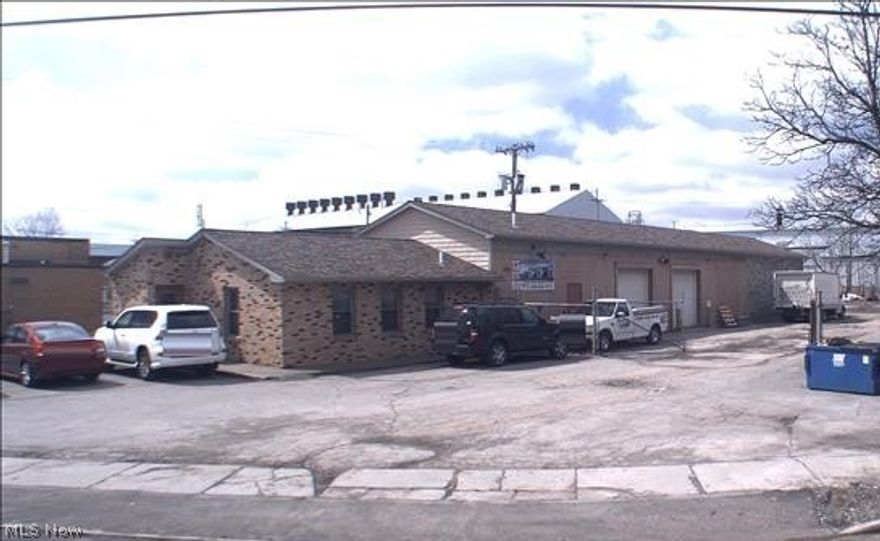 Great commercial property with endless opportunities, ideal for the following businesses: roofing, siding, plumbing, body shop, auto repairs, etc. The building offers 5 bay garage, 2 offices with reception area, half bath, large lot with barb wire fencing. Updates: Roof 2016, Windows 2016, Central Air 2018 and remodeled office.