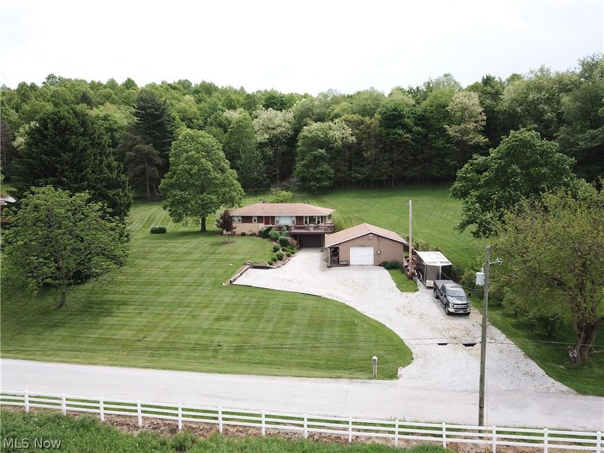 Love where you live! Enjoy the peace and quiet of this country setting home on 1 acre of land! The view from the front deck offers stunning 360 views. Surround yourself in nature and enjoy the summer evenings in your garden or tinkering around in the additional garage/workshop. The detached 3 car garage offers its own separate 200 amp service, extra insulated and built in counters.Inside the home you will find an open concept living/ dining area great for entertaining. An updated kitchen with beautiful cupboards and countertops as well as stainless steel appliances to stay. Updated paint, fixtures, additional cupboard space and countertop complete the look. All three bedrooms are spacious and feature adorable built ins for storage. The lower level of this raised ranch makes the perfect spot for the pool table and bar area complete with barn doors!  Roof 2017, Central Air, 2018.