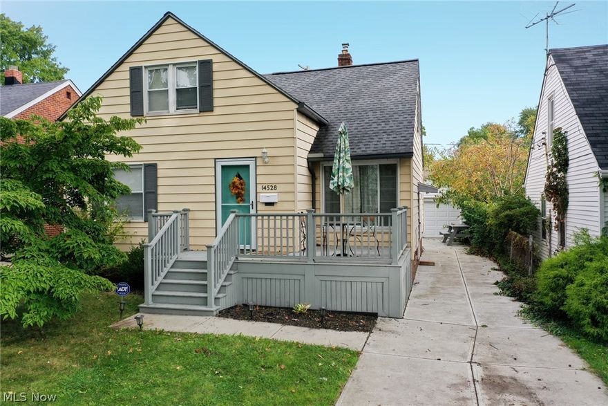 If a house could wrap you in a warm hug, this one would do so! Exposed hardwood floors & white woodwork adorn the main level where you'll find bright & comfortable living spaces! The updated kitchen (2014) boasts white cabinetry highlighted by a white tiled backsplash & ample counterspace.  All appliances (gas range, refrigerator, built-in dishwasher & microwave) are included.  The cozy dining room has built in china cabinets with endless decorating & storage possibilities & views of the private backyard. The remainder of the main level has two bedrooms & an updated full bath.  Upstairs is a very spacious finished dormer ideal for an owner's or shared kids' bedroom with great closet space & the abundant storage space common to this style of home. The basement features a finished rec room (2018) with recessed lighting & glass block windows.  Other highlights include ceiling fans throughout the home, an oversized 1 car garage w/newer door (2018), updated electric panel, roof new in 2017,