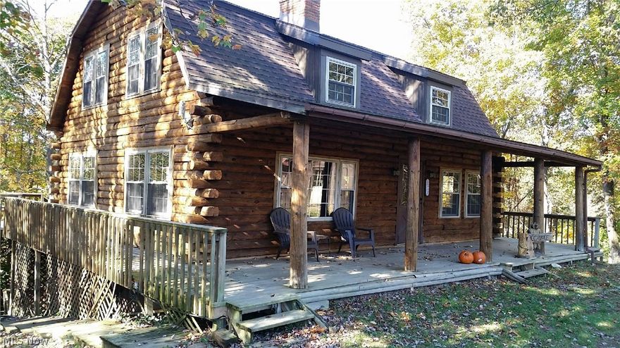 Beautiful log home on over 5 acres with open floor plan.  Home features large living room, sunroom, gas heat, central air, with a wonderful porch and decks all around.  Two storage sheds and detached 2 car garage.  Close proximity to a public lake and just minutes from downtown Barnesville.  Home has been freshly stained ready for the new owner!  Per seller home has public water as well (already installed, just need to set up account with utility company).  MOTIVATED SELLER!