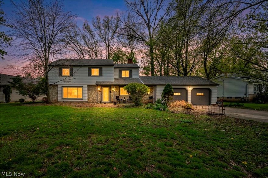 Welcome to a masterfully reimagined classic! This 4-bedroom Colonial has been thoughtfully renovated, trading its original Spanish-style interior for a sleek, modernized aesthetic defined by neutral tones and fresh updates. As you enter, you are greeted by a sophisticated mix of textures, including gleaming original hardwoods, luxury vinyl plank, and tile.

The main floor offers dual living spaces: a sun-drenched front living room with massive windows and a cozy family room anchored by a stunning, painted black fireplace that serves as a bold focal point. The heart of the home is the refreshed kitchen, featuring new butcher block countertops, a vibrant green subway tile backsplash, and ample cabinetry for all your storage needs. This space flows seamlessly into a bright sunroom, perfect for a dining table and casual meals, while an additional rear seating area provides the ultimate footprint for entertaining or unwinding, all while looking into the nature-filled backyard! Upstairs, the bedrooms retain their natural hardwood charm. One of the bathrooms beautifully pays homage to the home’s roots, featuring a unique Spanish-designed sink bowl and classic dark floor tile. Outside, discover an entertainer’s paradise: a lush, deep backyard equipped with both a deck and a patio. Located on a quiet street near parks, shopping, and quick access to the highway, this move-in-ready home offers comfort, style, and a prime location!