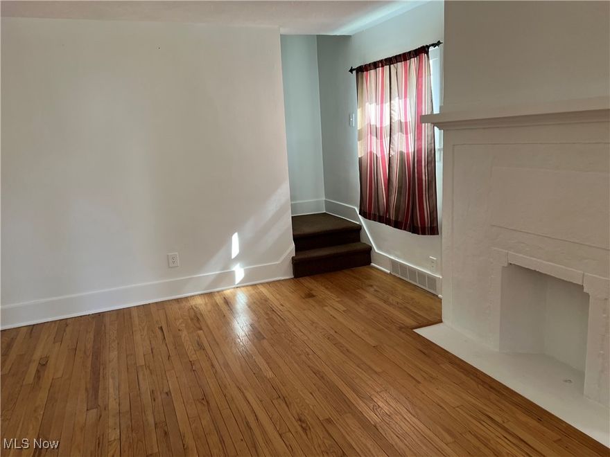 Enter this fabulous Home to a Foyer with a Vinyl Floor and Coat Closet and continue into the Living Room with a decorative fireplace as an accent and a Hardwood Floor.  Follow into Formal Dining Room with all Drapes for home stay and Hardwood Floor and ceiling fans.  You will find all Ceiling Fans in all rooms in this Beautiful home. Follow into the remodeled Kitchen with Vinyl Floor, Farmer's Sink, and Modern White Cabinets.  Newer windows that let a lot of light into this fantastic home.   On the Second Floor, you will find 2 Large Bedrooms with Large Closets and Newer Windows.  The one Bath in this home is Large and remodeled with a Large Closet with Mirrored Doors and Vinyl Floor.  The Basement is just a basement and could use your imagination.  There is a room that has been built that is 18 X 11.  I don't know what it was used for but you could think of something if just for storage.  Before you go to the basement step outside in the backyard where you will find a deep lot, 1.5 Car Garage and there is a concrete pad that you could make a great patio area