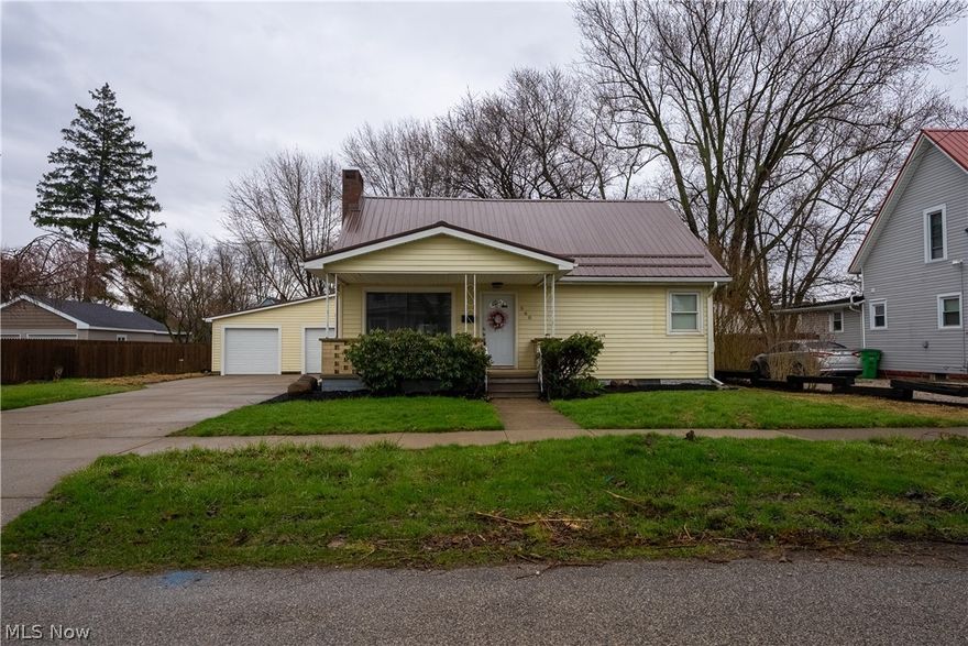 Beautifully Updated Bungalow with New Roof and Furnace! Home offers 4 bedrooms, 2 full baths and a cozy front porch. First floor boasts decorative tile as you enter and then luxury vinyl plank flooring throughout. Living room has a large picture window that lets in plenty of natural light and a quaint fireplace. Kitchen features new cabinets and countertops and is equipped with all appliances. First floor master bedroom and bathroom includes a new ceramic tiled shower and double vanity. Additional first floor bedroom with nice-size closet. Second floor provides two additional bedrooms with newer carpet, and multiple storage spaces. Basement offers new washer and dryer, full bath, utility sink and sump pump, and plenty of space for storage or a hobby area. Oversized 2 car garage and fenced in backyard with a concrete patio to enjoy nature. Other improvements include: new vinyl siding, gutter guards, downspouts, duct work, hot water tank, garage doors, baseboards, trim, doors, hardware, electrical panel, outlets, and wiring, as well as 100 amp exterior disconnect. Move-in ready! Tremendous opportunity!