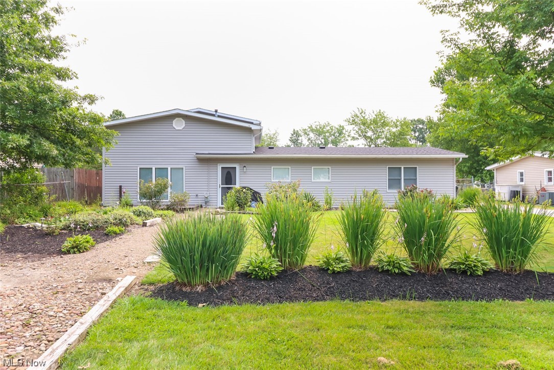 Large Midview Ranch with bonus second floor bedroom addition! Tons of square foot for the price! This 4 bedroom home is unique and has large open living spaces with vaulted ceilings. This bright home has a open concept Kitchen/Dining/Family room area waiting for your decorating ideas! There are 3 bedrooms on the main floor including a large master bedroom with huge walk in closet and a nook space to put a second closet, desk or vanity as well! The other 2 Bedrooms on the main floor have a doorway between them, that could be used as 2 separate bedrooms or a small suite for a teen on parent. On the Second Level is another bedroom that has an extra large walk-in closet and the ultimate in privacy! Huge covered porch for relaxing, and an oversized garage are in the fenced in backyard. Plenty of parking for your RV, Boat or for your parties ! One Year Home Warranty Included