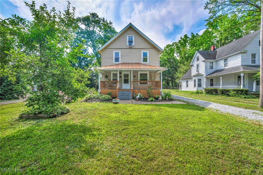 Welcome to this Beautifully Updated, Remodeled and move-in-ready Colonial Home located at 33895 Lorain Road in the heart of North Ridgeville. Boasting 4 spacious bedrooms and 3 full bathrooms across three finished levels, this home offers the perfect blend of character, modern comfort, and functionality. With approximately 2,390 sq ft of finished living space, including a full basement, this residence has been thoughtfully remodeled with attention to detail throughout. The inviting first floor features a light-filled open layout with heated ceramic tile floors in the living room, family room, dining area, kitchen, laundry room, and a full bathroom. The chef’s kitchen includes Quartz Countertops, a large center island, high-end appliances, recessed lighting, and brand new custom cabinetry—perfect for daily living and/or entertaining. A cozy den with natural hardwood floors adds flexibility as an office, playroom, or additional sitting area. Upstairs, you’ll find three generously sized bedrooms with luxury vinyl flooring, along with a spa-like bathroom with heated tile floors, double vanity, and contemporary finishes. The third-floor primary suite is a private retreat, offering a spacious bedroom, a large walk-in closet, and an elegant ensuite bath featuring a soaking tub, dual vanities, and beautiful city views. New Energy-efficient upgrades include newer windows, HVAC, insulation, appliances, lighting, and a smart thermostat. The full basement provides additional storage or future finishing options. Outside, enjoy a covered front porch, a rear porch overlooking the landscaped backyard, and a deep 50 x 275 lot with room to roam & Plenty of Parking. A 2-car detached garage with opener and extra parking complete the exterior. Located near schools, shopping, dining, with I-480 and 80 Turnpike access, this home offers suburban convenience with classic charm. Don’t miss your opportunity to own this stunning and spacious home—schedule your showing today before it’s gone!!