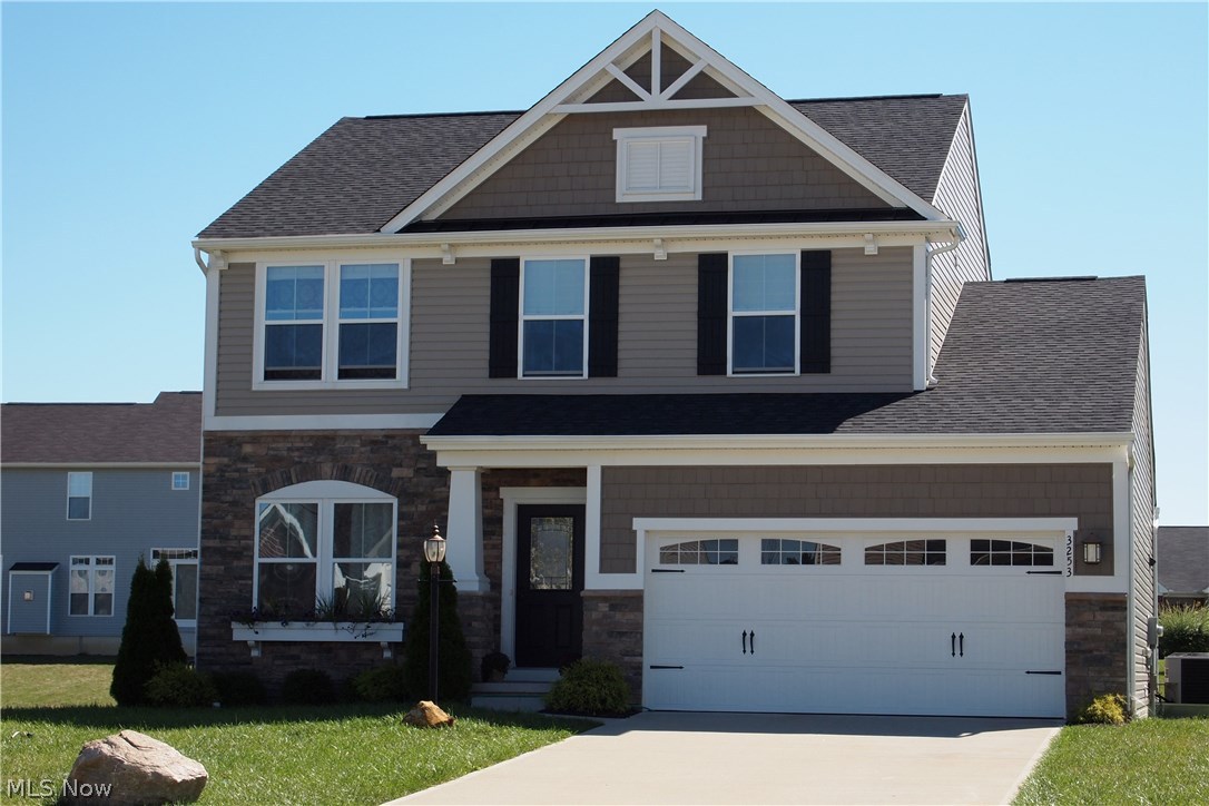 This craftsman inspired home features a striking shake detail, carriage-style garage door, a charming window box and an inviting covered porch. The first level, featuring oak hardwood flooring complimented by the upgraded floor molding,offers 9' ceilings, gorgeous kitchen with 42" dark espresso cabinets & walk-in pantry, upgraded light fixtures & recessed lighting, & modern, gas fireplace w/upgraded, custom mantel in the bright & cozy family room. As a bonus, enjoy the stainless steel appliances which stay, the surround sound which extends to the outdoors just beyond the sliding glass door, & the absolutely gorgeous, customized sliding barn door. The second level, which also includes the classy, upgraded floor molding, features 3 bedrooms with a loft, which could be made into a 4th bedroom. The huge master suite offers new carpet, walk-in closet and glamour bath with double sinks and an extra linen closet. The clean, full 8'basement waits your creativity and design! This IS a fenceable