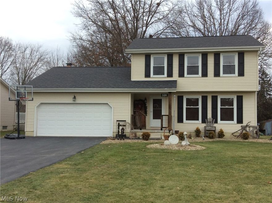 Extensively updated Hubbard home.  Beautiful new kitchen with dark maple cabinetry, glass front doors, pull outs, backsplash, crown molding, wine rack, recessed lighting, corner pantry and all appliances. Remodeled family room with fireplace, beamed ceiling and crown molding leads to the rear sun room. Sun room features plenty of windows and opens to the newly built rear deck and swimming pool (2018). Remodeled first floor half bath includes new vanity, flooring, trim and accent wall. Formal living and dining rooms complete the first floor. The second floor features the master bedroom with crown molding and two additional bedrooms. The full bath has been completely updated including tub surround, vanity, back splash and tile floor. The full basement is partially finished with a large rec room, tiled laundry area and plenty of storage. The heated two car garage has a new opener and a convenient utility tub. The covered front porch features new railings. Additional highlights include newer carpet throughout, high-efficiency furnace (2010), new hot water tank (2017), security system and windows. The spacious back yard features a 21 foot above-ground pool, playset, shed, plus a large 20 x 12 outbuilding with double doors - great for storing outdoor equipment. Don’t miss this gorgeous home.