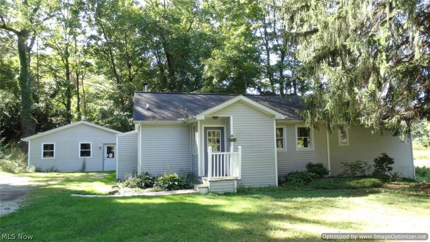 Charming 2 Bedroom & 2 Full Bath Ranch nestled on 2.78 wooded acres! Over 1200 finished sqft with neutral decor & hardwood floors throughout. Living Room with vaulted ceilings open to Kitchen with appliances. Large oversized Master Bedroom with walk-in closet & private full bath. Loft area for storage. Central air. New water softener. Newer roof. Updated electrical. Security system. 20x22 outbuilding with additional storage area has newer vinyl siding and can easily be converted back to garage. Enjoy views of nature & ponds from deck. Seller will be installing new septic system. 1-yr Home Warranty. Berkshire Schools.