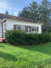 Darling 2 bedrooom bungalow on a double lot. Some hardwood, other rooms getting new carpet. Newer roof & windows, new gas furnace, public sewer. Minerals reserved.
