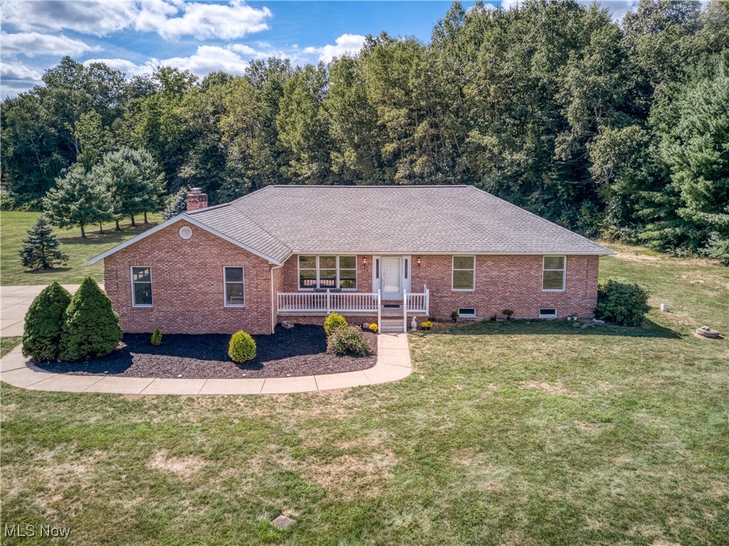 This one-owner brick ranch is move-in ready and has been meticulously maintained, offering the perfect blend of comfort, functionality, and space with two parcels totaling 11.26 acres. The home features 3 bedrooms 2 full baths and 1 half bathroom, including a spacious primary suite with en suite bathroom, and a large basement providing abundant storage or room to finish for additional living space. Enjoy the warmth of a fireplace on the main level and a basement fireplace equipped with a clean coal burning stove.
Modern updates include geothermal heating for energy efficiency, new water softener and a newer roof (2019) for peace of mind. Outdoor living is enhanced by an impressive 30x40 outbuilding with a large loft, fully equipped with water and electric, perfect for a workshop, equipment storage, or could be utilized for animals.
With expansive acreage, mature trees, and peaceful surroundings, this property offers endless opportunities—whether you envision recreation, keeping animals, gardening, or simply enjoying the privacy of country living. Rarely does a well-cared-for, one-owner brick ranch on acreage like this come available.