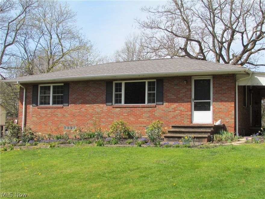 Beautiful brick ranch home on seven acres in Suffield Township! This home features three-bedrooms, one and one-half bathroom, solid hardwood floors and well crafted tile work in the kitchen and bathrooms. Lower levels hosts a 11' x 17' rec. room and back-up wood burner to supplement the heating. Covered patio off the kitchen is a favorite spot to relax and enjoy the peaceful country setting. What a wonderful piece of property-long rolling hill which leads down to the pond and back woods, which makes for a great hunting spot. Ideal for livestock with several acres of fenced in pastures and the 24' x 40' newer metal pole barn which has electric, stalls and a hay loft. Also included is a 20' x 40' metal tractor'implement barn, a 12' x 24' detached one-car garage with concrete floor, double car-port and attached two-car garage. Must see! move-in ready. Schedule your showing today.