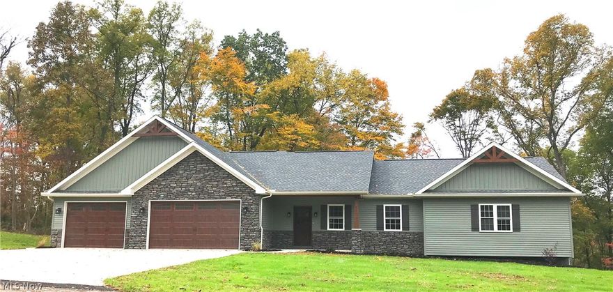 Brand new construction. This custom built Craftsman Style ranch is situated on 3.6 wooded acres. It has 3 large bedrooms, 3 1/2 baths and an attached 3 car garage. The open concept floor plan is sure to impress with cathedral ceilings, a stone fireplace in the living room and an amazing sun-room off of the back of the house with gorgeous views of the woods. The kitchen has a large center island, solid surface counter-tops and Schlabach cabinetry. The Master suite has a large walk in closet, a private bath with a double vanity, a corner jacuzzi tub and double shower. It also includes it's own private door out to the back deck. There is a full walk out basement that is partially finished for a family room with patio doors out to a lower patio area. This home has so many custom features throughout it is hard to express them with words, this is a must see property!