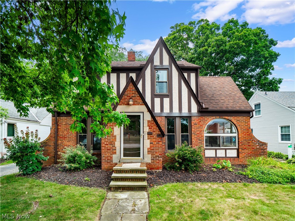 Historical charm and features are plentiful in this charming 3 bedroom 1 1/2 bath colonial Tudor home conveniently located by everything that Rocky River has to offer! This beautiful home was built by The Bilt Rite Homes and Financing Company in 1930. Filled with many original architectural features including built-in bookcases, historic placards, Cleveland-made Certified Masonry-Walls by the Cleveland Clay League, hardwood flooring, a stunning fireplace surround with a wood burning stove, solid wood doors with original glass/brass knobs, a second-floor balcony, a large outdoor patio, and a metal-fenced backyard. The previous owner was told that the basement is one of only a few certified bomb shelters in the area (unverified) because of the masonry work. Updates include: new A/C 2023 and new plumbing 2020. Close to schools, the library, shopping, dining, the middle school field, and more! A home warranty is included for added peace of mind. Schedule your private showing today!