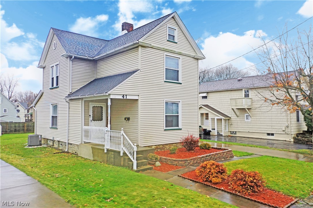 Packed with tasteful updates that fill its two floors of clean, casual living space; this beautiful Girard home isn’t going to last long! The tall residence is trimmed in colorful red mulch work with tidy landscaping leading to the covered front patio entrance. Inside, enjoy the robust hardwood-styled flooring that fills the coat room, before spilling into a central dining area and nearby kitchen. The dining area itself offers an elevated chair rail that sweeps around to a pass-through serving window complete with bar top seating. A sculpted archway reveals the posh, carpeted living room that enjoys the natural light of the surrounding picture windows. Back to the kitchen, bold blue walls pair expertly with the white cabinets and stainless appliances. A faux brick backsplash finishes the look. Near the main stairway, a cozy half bath features a stylish vanity and first floor laundry service. Upstairs, three spacious bedrooms include an oversized master and two guest bedrooms at mid hal