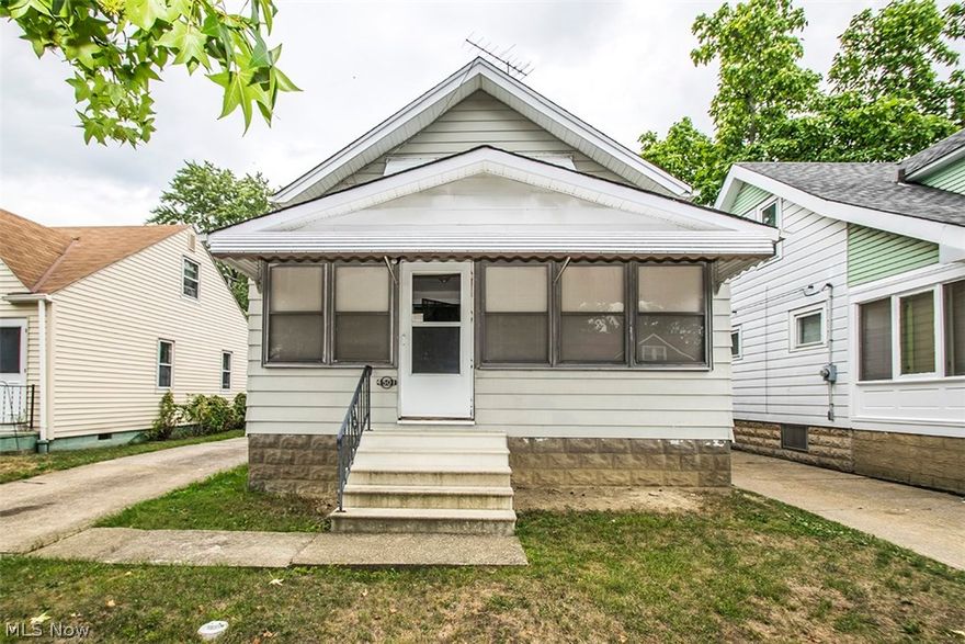 Check out this renovated West Park bungalow! Unique open floor plan includes spacious kitchen featuring plenty of counter and cabinet space.. appliances included! Dining room open to kitchen! Basement waterproofed! Newer electric panel and most new wiring! Newer windows! Enclosed front porch expands living space! Home Warranty included! Priced to move!!