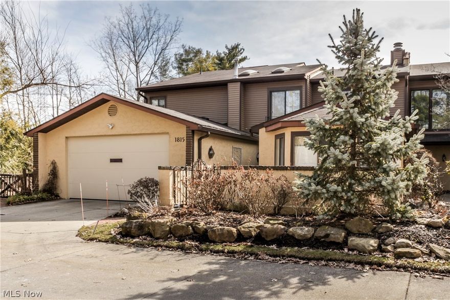 This Spacious and Elegant End-Unit Condominium is in the popular Village of Brookwood. With a lovely, private setting, the home has wooded & pond views and 4171 square feet of gracious living! The side garden and brick patio leads to a deck at the back of the home. First floor master bedroom and updated bath has two walk in closets.  A very inviting sun room overlooks the pond.  The Living Room and Library have built in bookshelves and marble fireplaces (gas).  The Dining room is a great gathering space with a wet bar, ample storage spaces and easy access to the family room/kitchen, sunroom and living room.  The Family Room has a wood/gas fireplace and an open floor plan that includes the Kitchen and eat-in area with easy flow back to the Sunroom and larger Dining area.  The Kitchen has a large island, with multiple pantries (one is a walk-in pantry) and newer appliances.   All bathrooms in the home have been updated.  The large First Floor Laundry has new luxury vinyl tile floors, muc