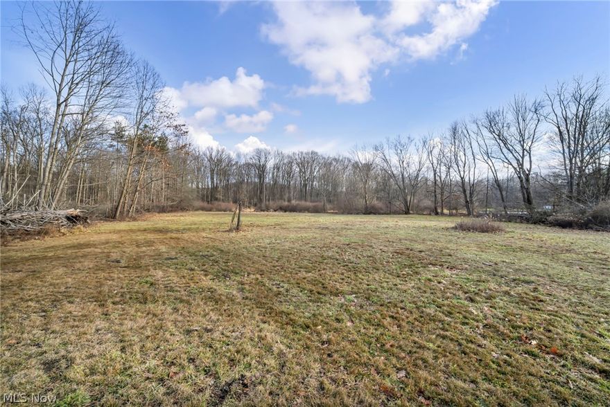 Hard-to-find 4.25 acres in the Boardman School District offering space, privacy, and the opportunity to build exactly what you envision. The front portion of the property features a wide, mostly level clearing that would work well for a long private driveway and flexible home placement, while the wooded rear provides a peaceful natural backdrop. The land is largely flat and usable, giving you several options whether you envision a ranch-style home, custom build, or a home set farther back on the property for added seclusion. Recently surveyed with direct road frontage on Sharrott Road. Public water, sewer, natural gas, and electric are available at the street (not currently connected). There may also be potential to divide the parcel with township approval, making this an opportunity for builders, investors, or those looking to secure land for the future. Conveniently located just minutes from shopping, dining, and major routes while still offering the space and privacy that can be hard to find. Walk the property and start planning your future build.