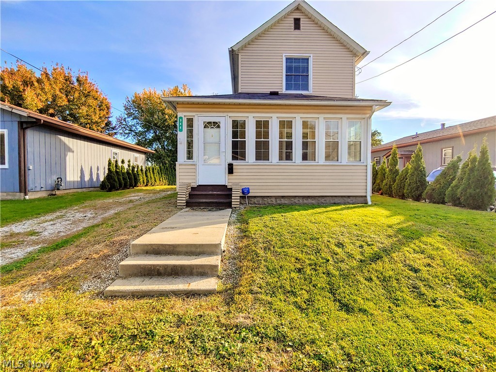This beautiful well kept home is the house you've been waiting for and in a great location! All the updates have been done, just move right in! There's a newer roof, siding, windows, kitchen with maple cabinets and appliances, updated bathroom, exterior doors, laminate flooring 2019, furnace 2012, newer hot water tank, and freshly painted. Walk up to the front door and there's an enclosed front porch/sunroom with new laminate flooring to relax on and enjoy. Inside features gorgeous new laminate flooring in the inviting living room and dining room, and both rooms have ceiling fans. Cooking is a breeze with all the counter space and cabinets in this bright kitchen! There is a bright and airy bedroom on the first floor with ceiling fan, and updated full bathroom with shower/tub combination. The full basement has laundry area and plenty of storage space. The backyard is great for entertaining family or friends, it offers privacy, a nice newer shed for storage, and fire pit for bonfires to