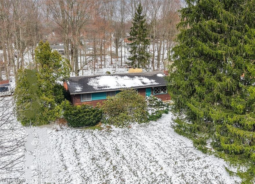 Fantastic Aurora Value with Endless Potential! Opportunity knocks with this solid 4-bedroom, 2-bath ranch offering easy one-floor living on a spacious, treed lot tucked away at the quiet cul-de-sac end of the street. Step inside to a bright, open living and dining area featuring great natural light and a cozy wood-burning fireplace—perfect for everyday living or entertaining. The kitchen is conveniently located just off the dining room and includes all appliances, with a nearby laundry room for added functionality. The home offers four bedrooms, including a primary suite with direct access to a full bath, plus an additional full bath off the main hall. A large, enclosed breezeway connects the home to the garage, creating a flexible bonus space ideal for a mudroom, home office, or playroom. The oversized garage includes a rear overhead door for easy backyard access. Recent updates include newer carpet, along with a furnace and A/C that are just 3 years old—giving buyers peace of mind on major mechanicals. Set on a generous lot in the highly desirable Aurora School District, this home offers an incredible upside for buyers looking to add their personal touch. Conveniently located near shopping, dining, and all that Aurora has to offer. Priced to sell—bring your vision and make it your own!