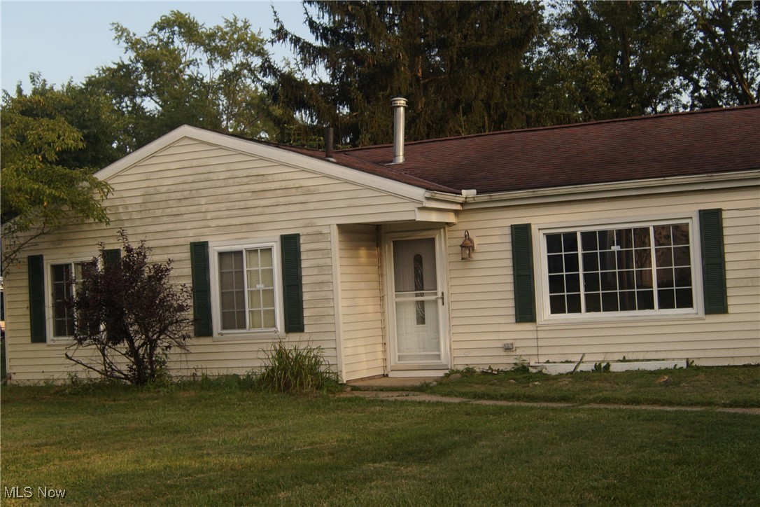 This home is ideal for a handy buyer. The carpet has been removed and the interior painted; flooring and doors need installation. Features include a spacious kitchen with ample storage, options for gas or electric stove, four bedrooms (three together, one could be an owner's suite or guest room with a wood-burning fireplace), attached garage with a circle driveway, and a backyard deck on over 0.60 acres. The shed includes electricity. Schedule your showing today. Buying AS IS. Seller unable to make any repairs. The location is great near all the shopping and restaurants in Streetsboro. Easy access to Turnpike and 480.