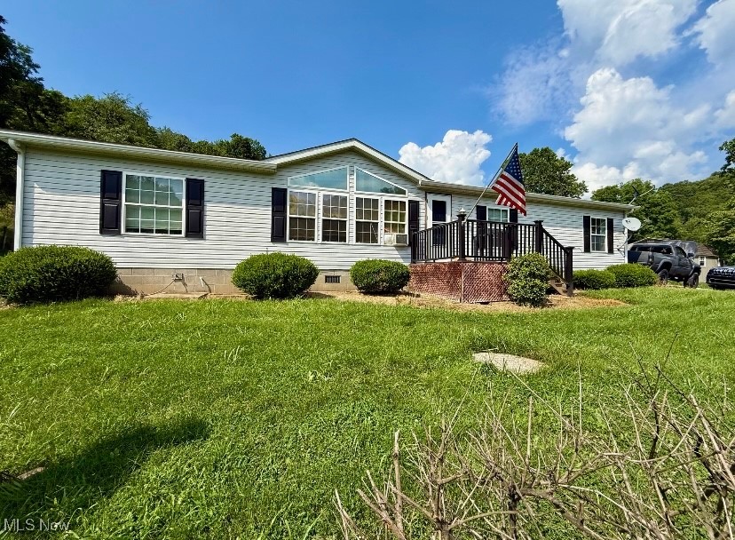 Experience country living on over an acre of land with this spacious 3 bedroom, 2 bath manufactured home! Inside, you'll find an inviting open layout that combines the kitchen, living room, and dining area---ideal for gatherings and everyday living. The kitchen comes complete with stove, refrigerator, microwave and dishwasher. Enjoy extra space with a cozy family room and large sunroom addition that conveniently connect to the generous garage. The garage boasts an upstairs area, perfect for a workshop, craft room, man cave or simply storage. Outside, the expansive yard includes a handy shed and a back patio that's ready for your hot tub or outdoor furniture, making it a wonderful spot to relax and take in the peaceful surroundings.