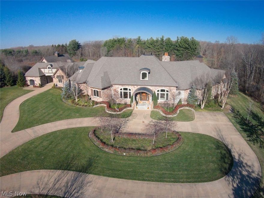 One-of-a-kind Showplace! A "hidden" treasure in Medina! Over $4.25 million in the original construction of this 14,000 sq. ft. magnificent palatial Estate! Privacy & a luxurious lifestyle can be enjoyed inside & out with fabulous views of 11 sprawling acres. In-ground pool, hot tub, open & covered patios, outdoor Kitchen, gas fire pit with built-in seating and 2 waterfalls. Entertain with ease in this expansive Great Room, banquet-sized Kitchen, 12-seat Home Theater & 2nd floor Game Room. The 1st floor Owner's Suite includes a Dressing Room, private Library, luxury tub, & marble steam shower. Additional features include a Home Gym, tanning room & heated garages for 13 cars. Zoned also as a horse property. Unmatched!