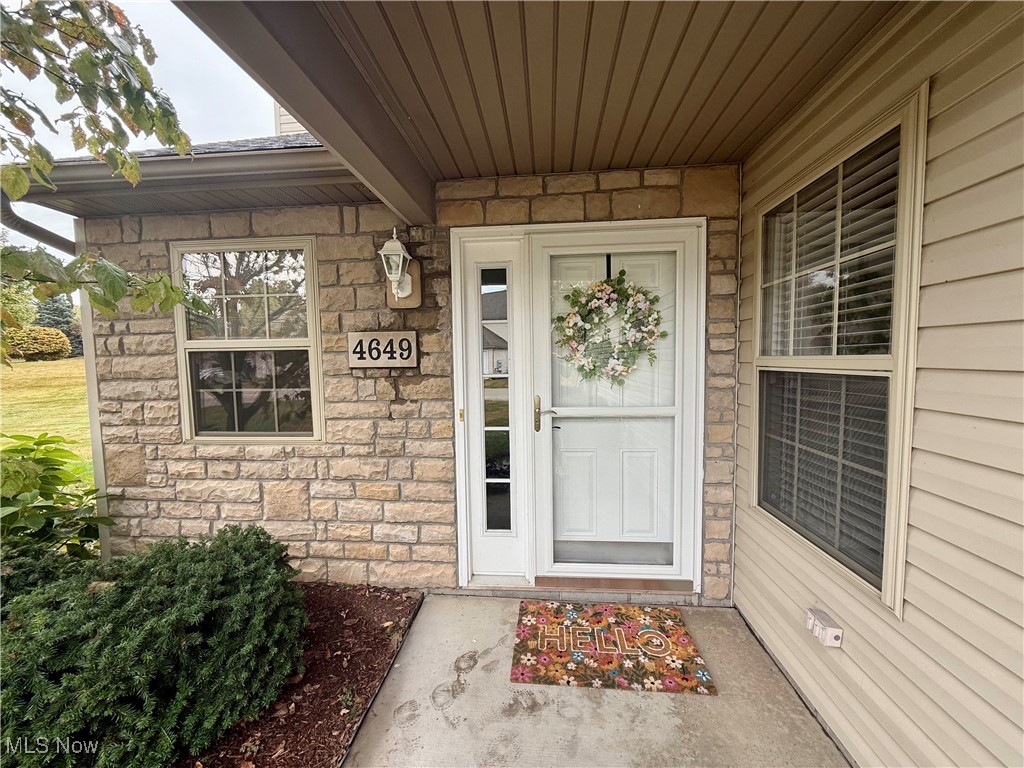 Welcome to this beautifully updated impeccably maintained condo in the highly desirable Pleasant Lakes neighborhood in Kent, Ohio. This condo has 3 bedrooms, including a first floor bedroom, 2 full bathrooms, including a 1st floor full bathroom with walk in shower, and an oversized 2 car garage with plenty of storage and additional attic space. This condo has a plentiful amount of natural light, along with a 2-story cathedral ceiling of an open floor plan that was completely re-painted in 2023. The large living room has an electric fire place that leads to the huge private concrete patio (extension new in 2024) and the dinning area has plenty of room for your large gatherings. Next to the dinning area is a the large kitchen with a peninsula bar with more seating. The back hall leads to a very large 1st floor bedroom with deep closet space. Full bath with shower (completely renovated in 2024) is steps from the 1st floor bedroom as well as the laundry (hot water tank new in 2025), 2 car garage and kitchen. The 2nd floor includes two bedrooms (renovated in 2024) that connect to a jack and Jill bathroom with tub shower combo. The primary bedroom (updated in 2024) has a HUGE walk-in closet and another double door closet. Additional bedroom upstairs also has a walk-in closet. Schedule your showing today as this beautiful condo will not last long!