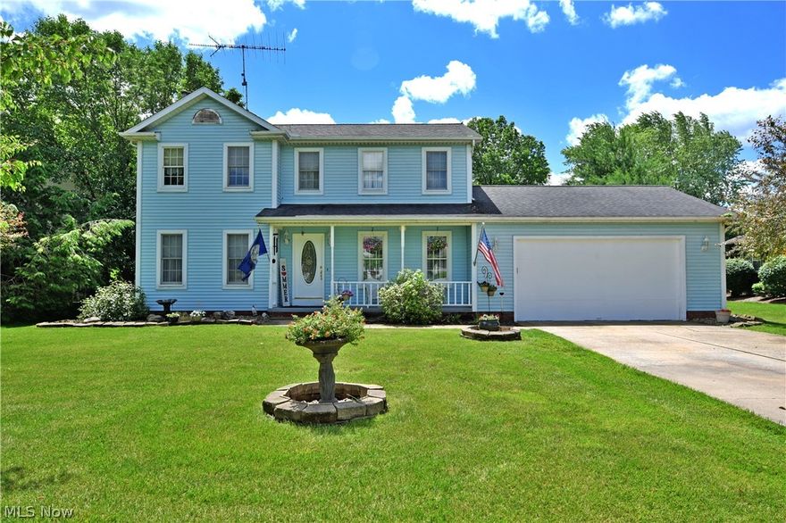 Enjoy this beautiful Champion home, filled with high quality materials and style! This large two-story residence stands proudly with its inviting light blue exterior and tasteful landscaping. A concrete drive leads to the attached two car garage, as you make your way beneath the covered front patio and inside. Here, you’ll be greeting with gorgeous custom  hardwood flooring that runs throughout the first floor of the home, perfectly complimenting the matching stained wood trim work found along the baseboards and window casings. The first floor offers an expansive open living room with a lovely brick mantle and fireplace. Opposite, a formal dining area allows for a beautifully chandelier lit meals on those special occasions. The robust kitchen provides an array of natural wood cabinets along with an eat-in dining area sat before the relaxing rear patio and cabana entrance. A half bath completes the first floor. Upstairs, a trio of large bedrooms allow for big living space as a full bath