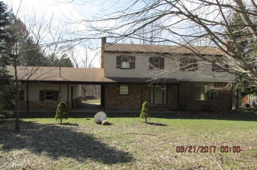 Large colonial on nearly three acres.  Garage is attached to the house by a breezeway.  House has two full and one half bath and two fireplaces.  The five bedrooms are all upstairs and will accommodate a large family.  Being sold "as is".  Buyer must assume point of sale inspection and any repairs regarding the septic system.