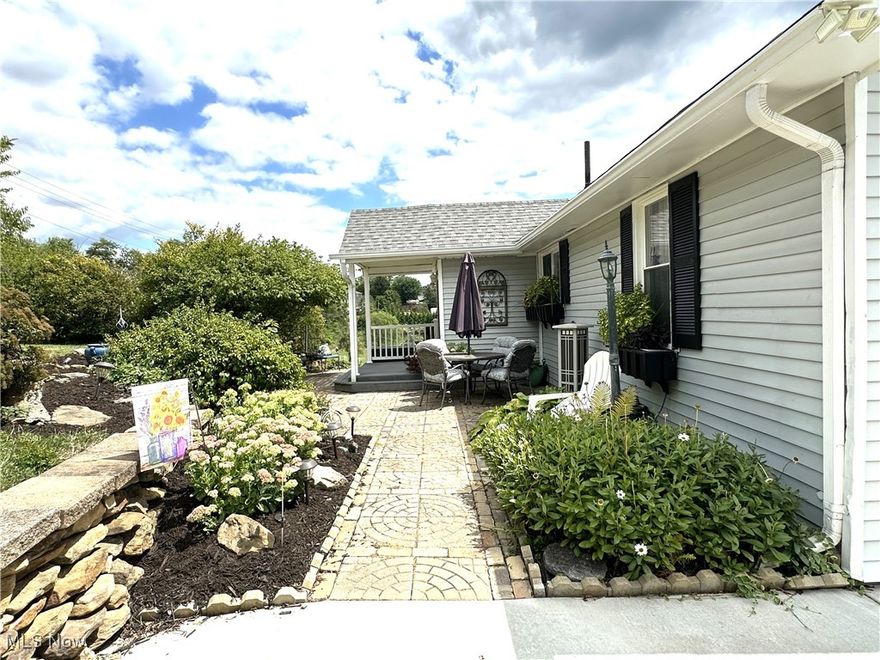 Don't miss this very cute and well maintained Home close to school, church, and shopping.. Beautifully landscaped with all new concrete driveway, covered front porch, sliding doors of off kitchen to covered patio. the inside has all newer laminated flooring in LR,DR,Hall and Kitchen. Master bedroom on first floor with second bedroom in the upstairs with 2 large closets for storage. A third bedroom is set up in the lower level with a full bath with oversized walk-in ceramic shower, walk-in closet and recroom . Newer roof, windows,(at various times),200 amp electric service, new hot water tank in January,
kitchen has stainless steel appliances, washer and dryer stay. 
Call to make an appt and see this lovely home.