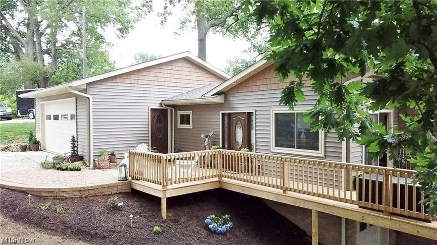 All of the charm of cozy Meyers Lake with all of the updates of a brand new home! There is also a small lakefront parcel that is available and can be negotiated into the cost of the home! A new addition consisting of an oversized 2 car garage, first floor laundry, a foyer, half bath, AND storage underneath...resulting in over 2000 SQ FT total living space! That is just the beginning. The original structure has been updated with granite countertops, an open concept living and dining area which both open to the large deck with a stellar lake view. The walk-out basement is finished with another full bath, bedroom, family room and the 10x20 storage garage mentioned above. You would never know that you are in the middle of Canton. This is the PERFECT home to escape to! The Sellers have taken this cabin that was original to Meyers Lake and turned it into a dream lakehouse for year round living. Call me today to see it for yourself!