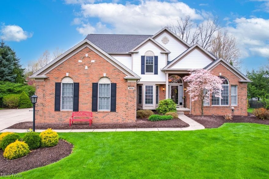 Here's your chance to own this entertainer's dream home located in the desirable Ledges community of Twinsburg.  With over $400K in upgrades, including the exterior and interior, this 5 bedroom, 3.5 bathroom home is set in a quiet cul-de-sac on over a half-acre.  Luxurious, vaulted ceilings welcome you into the home and into the main living room.  A pass-through fireplace can be enjoyed from both the living room and spacious kitchen, upgraded with granite countertops and stainless-steel appliances.  The first-floor primary suite features a large ensuite bathroom, high ceilings and fantastic views of the backyard.  Upstairs are 3 bedrooms, one currently opened up above the kitchen being used as an office, and another full bathroom.  The finished basement is great for entertaining with 1300 finished sq ft including a wet bar/entertainment area, walk-out access to the backyard, room for a home gym and still plenty of storage.  An elevated back deck overlooks your own personal oasis.  The resort-like backyard features a hot tub cascading into a sparkling pool for you to cool off on those hot summer days.  There's plenty of room for all your friends and family to gather on the multi-level 4500 sq ft stamped concrete patio or relax in the Amish-built gazebo with beautiful gas fireplace and huge screens to catch that summer breeze.  Add a 3-car garage and landscaping that is sure to impress in any season, this one-of-a-kind property is not one to miss; schedule your showing today!