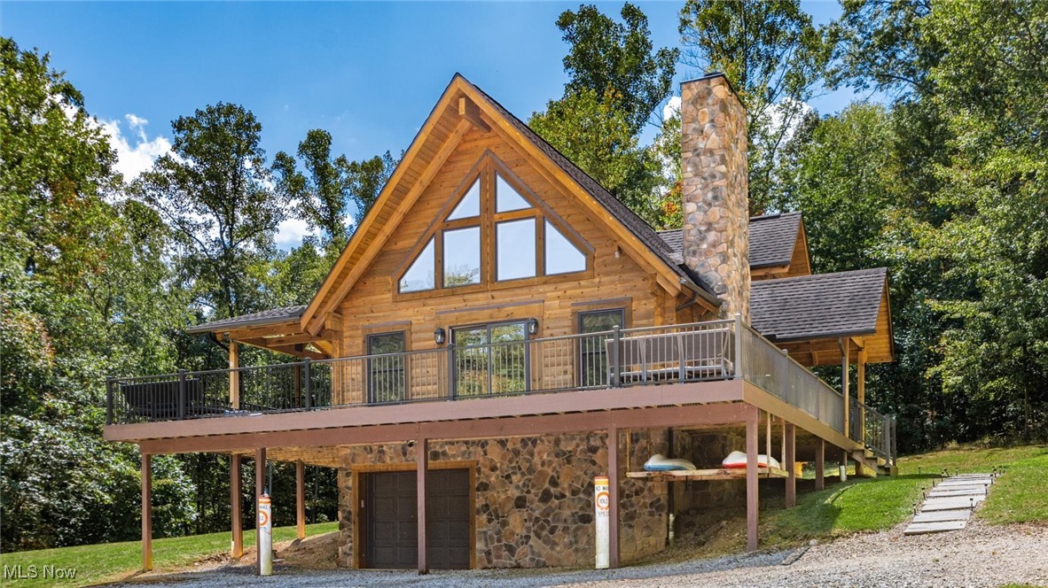 Nestled on 1.16 acres of serene natural beauty within the borders of Seneca Lake, this pristine log home is a true blend of craftsmanship, comfort, and lake lifestyle. Built with timber harvested directly from the property, this one-of-a-kind residence offers a rare combination of authenticity and modern convenience. Step onto the Weathertech wrap-around deck, perfect for morning coffee, evening sunsets, or entertaining under the stars. Inside, you'll find a warm, inviting atmosphere anchored by a wood-burning fireplace, ideal for cozy nights in. The heart of the home is a stunning Lamar-designed kitchen featuring Carrara marble countertops, high-end finishes, and plenty of space for gathering. Whether you’re cooking for two or entertaining a crowd, this kitchen is built to impress. Enjoy lake privileges with access to a private dock, making it easy to boat, swim, or simply relax by the water. And with a whole house generator, you'll enjoy peace of mind no matter the season. Whether you’re seeking a peaceful retreat, a year-round residence, or a unique vacation property, this log home delivers timeless character with modern luxury. Located on private land with no lease fees this property holds multiple possibilities.