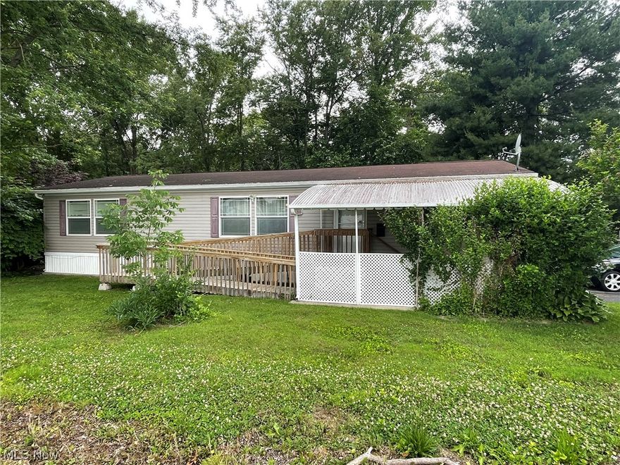 This is a great opportunity to acquire an affordable & beautiful home, in a desirable school district, and peaceful neighborhood. Welcome to 236 Evanston Ln in Amherst Trails - a comfortable, well-maintained 3-bedroom manufactured/mobile home, perfect for those seeking a cozy, functional space. The heart of this home is the open-concept great room. It incorporates a practical kitchen with ample cabinet and countertop space, a dining area, and a living room featuring an antique-style stove. This setup creates a warm, inviting area ideal for everyday living and entertaining. The master bedroom is sizeable and includes a spacious en-suite bathroom for privacy and convenience. The two other bedrooms offer additional space for family or guests. Outdoors, you'll appreciate the additional storage offered by the woodshed and the privacy the lot provides, adjacent to a woodland area. Enjoy the peace and quiet from your back deck, perfect for relaxation. Situated near Route 2, Interstate 90, and