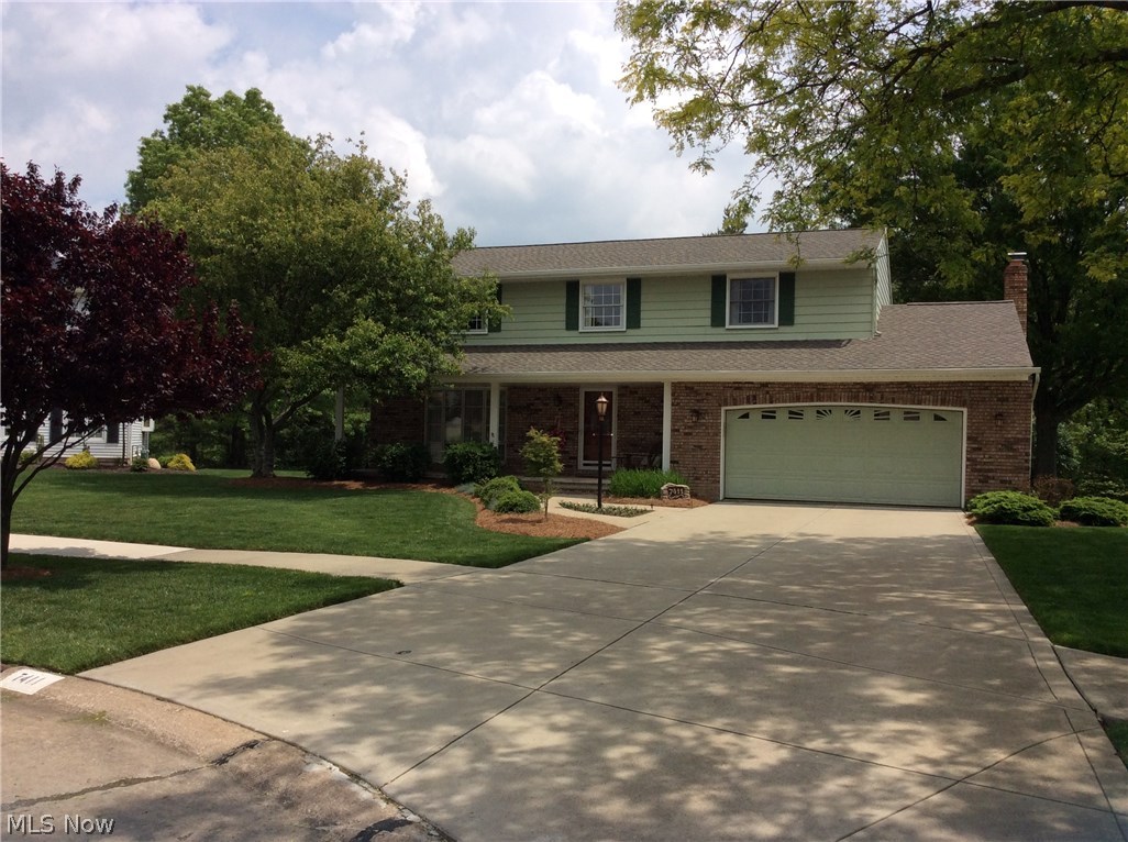 Pride of ownership! This four bedroom colonial on a quite cul de sac has been well maintained. You will love the relaxing front porch as you enter the home. The main level has a spacious living room with a bay window and leads to the formal dining room. The dining room has hard wood floors and is great for entertaining. The eat-in kitchen has been updated with Amish made maple cabinets and glass tile backsplash. The is a pantry and all the appliances are included. There is a half bath on the first level as well. The cozy family room has a fire place and a sliding door that leads to the 2 tiered deck. The upstairs has 4 bedrooms and 2 full baths. The master bedroom has been updated with double sinks and a walk in shower. There are 3 other spacious bedrooms. The attached 2 car garage has nature stone flooring. Most windows have been replaced. The roof is new as of April 2017. The lot on this property is beautiful. It backs to The Metro park. The owners have enjoyed turning their yard int