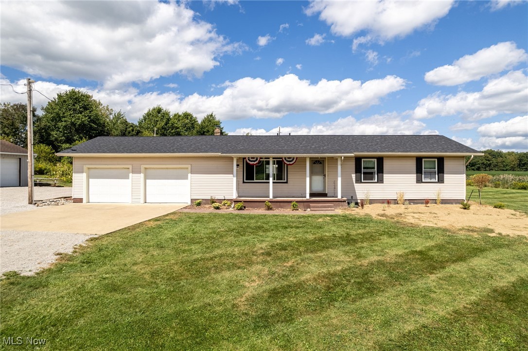 Welcome to this adorable Ranch home that's move-in ready and better than new! This 3-bedroom, 2.5-bathroom house sits on a generous lot with 2,206 square feet of thoughtfully updated living space. Everything has been refreshed in 2024 and 2025, from top to bottom. The new roof, windows, furnace, air conditioning, and tankless water heater mean you can relax knowing the big-ticket items are handled. Step inside to discover beautiful new flooring throughout, fresh carpet, updated interior and closet doors with modern hardware, and stylish overhead lighting including ceiling fans in every room. The kitchen shines with new cabinets, quartz countertops, undermount sink, garbage disposal, updated faucet, microwave, and attractive backsplash. Automatic blinds in the main living area add a touch of modern convenience. The primary bedroom features an enclosed bath with new flooring and a trendy barn door. Bathrooms boast new tubs, surrounds, and vanities. Glass block windows add character while new electrical panels ensure everything runs smoothly. Outside, you'll love the extensive outdoor space and lot size that provides plenty of room to spread out. The property includes two barns - one with added water access and exterior lighting. Recent waterproofing and an enclosed walk-out basement expand your usable space. Fresh landscaping, painted shutters, and a lifetime warranty sump pump complete this incredible package. With propane added to the property, this home truly has it all! Call today for showing!