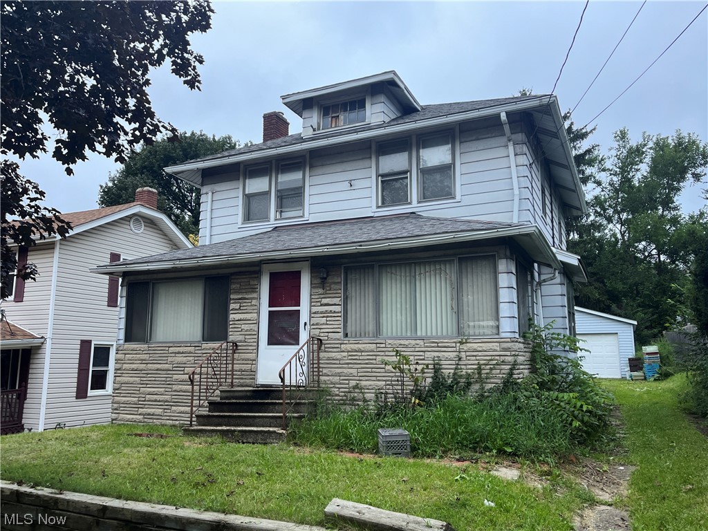Calling all investors! This home is ready to be cleaned out and restored to its former glory. Located on a dead end street with a 2 car detached garage and lots of privacy. The cozy front porch leads you into a spacious living room and dining room with hardwood floors throughout. Upstairs there are 3 bedrooms and a full bath. Selling AS IS and the home needs a lot of TLC but priced to sell!