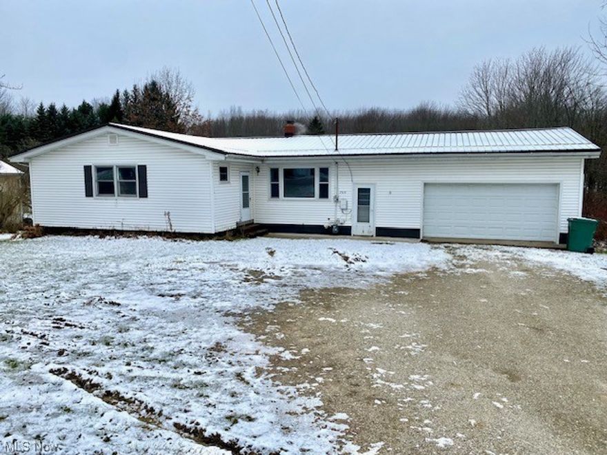 Ranch home featuring three large bedrooms, attached oversized two car garage, on a large lot with a barn and chicken coop. Metal Roof 2020, Septic 2020, Hot Water Tank 2020, Furnace 2020, Windows 2020 and a 30x32 barn. Enjoy the view while sitting on your back deck. Full unfinished basement that provides laundry room, storage and a working toilet. All appliances stay.