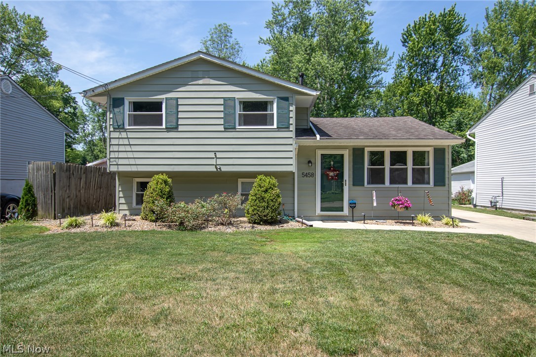 Welcome home to this lovely, updated split level! With 3 bedrooms, 1.5 baths and many updates, it's ready for you to move right in! The living room is bright and cheery, and flows into the eat-in galley kitchen with updated flooring (2019). The lower level features a half bath (vanity - 2019), large family room and another connected room that would be perfect for an office or playroom. Upstairs you'll find three bedrooms and a full bath with tiled shower. The outside has been updated too! Newer concrete driveway (2013), extra deep garage with workbench, and a new fire pit area (2020)! Other updates include: hot water tank (2020), furnace and A/C (2013), windows (2013), and kitchen appliances (2103). This one won't last long!