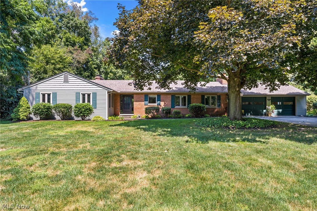RARE RANCH! Enjoy Twin Lakes at its best in this meticulous 3BD/2BA home in a tree-lined and picturesque setting. This gem was completely renovated from head to toe in 2005 - think new construction in a timeless mid-century shell! No detail was left unturned - roof, insulation, siding, windows, HVAC, and upgraded electrical panel (all 2005). The remodeled kitchen features natural maple cabinets with matching facing on the appliances and LVP flooring, and it transitions beautifully into the family room with gas insert fireplace (2020). The formal dining room flows to the bright and open living room with large picture windows and includes a second fireplace. Relax inside the sizeable 3-season room or enjoy the lush landscaping, waterfall feature, and private .5+ acre yard from the patio. The spacious master suite (renovated in 2005) includes a dual sink vanity, dressing area, walk-in shower, and a convenient laundry nook. Two generous bedrooms and another full bath with tub round out the