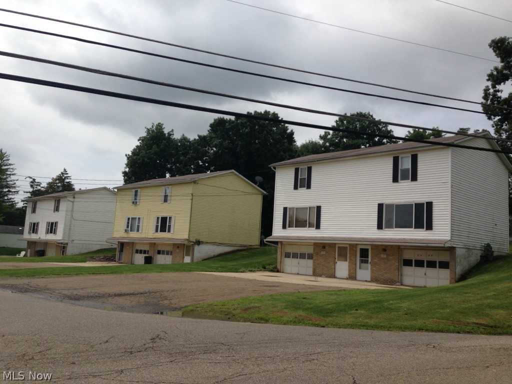 For Sale: Three Duplex buildings on Millvale NE just off Lesh St NE! Each two story duplex consists of approx. 2080 gross square feet of living area and a two car garage on the ground level. Each unit includes two bedrooms, one bath, kitchen, dining and living room.