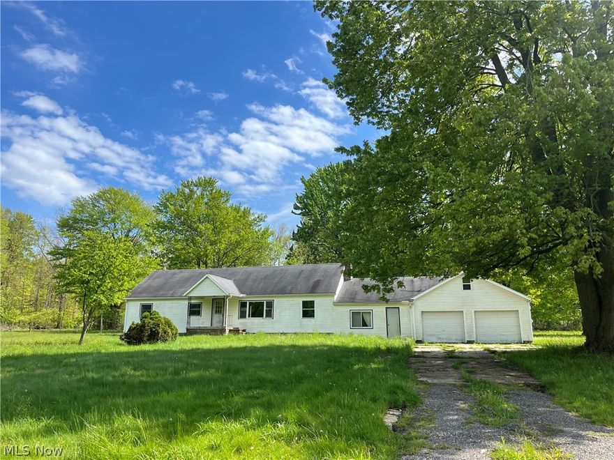 16+Acre property in Geauga County with lots of possibilities! Fix up this handyman special home, or tear the existing structure down and build your dream home on 16+ beautiful wooded acres in Geauga County (addressed in Madison, taxed in Geauga, Berkshire Schools). Existing house is a 3BR 1BA 2000+ sq/ft ranch with attached 2 car garage and workshop. Needs full remodel. Home is being sold AS-IS. Survey prepared in 2025 available upon request. Cash only. Also listed as Lot/Land MLS#5209497